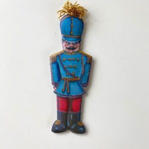 Vintage Department 56 Pressed metal Christmas ornament.